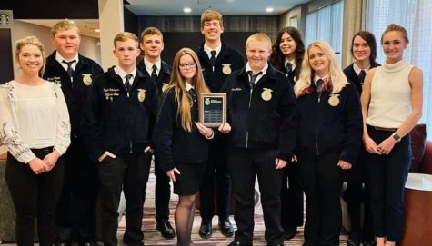 Sterling FFA stands together after being recognized on stage at the 94th annual National convention for receiving a national FFA 3-star ranking. this is the first year that Sterling FFA has received the 3 star ranking 