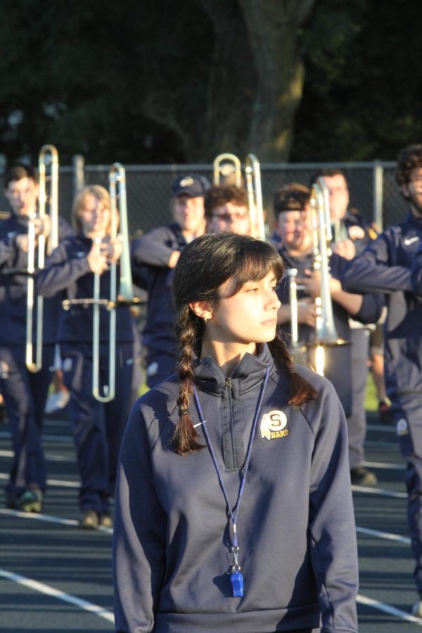 Senior drum major Kiara Olinger marches the S.H.S Band. This is Kiaras second year as drum major.