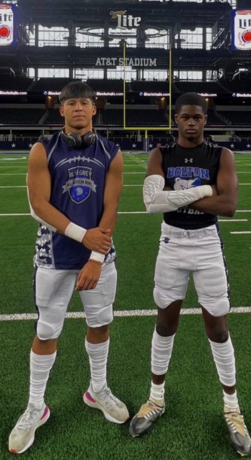 Senior+Antonio+Tablante+and+another+prospect+pose+on+the+Dallas+field.+The+bowl+was+an+invite-only+event+for+high+school+football+players+who+are+looking+to+play+in+college.