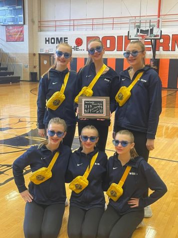 SHS poms competition team poses with their 2nd place plaque at the Kewanee Innovational. This was the teams 2nd year going to this competition.