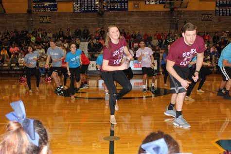 Past guy/girl dancers performing in front of SHS fans. The guys learned the dance for tonight a week before the game.