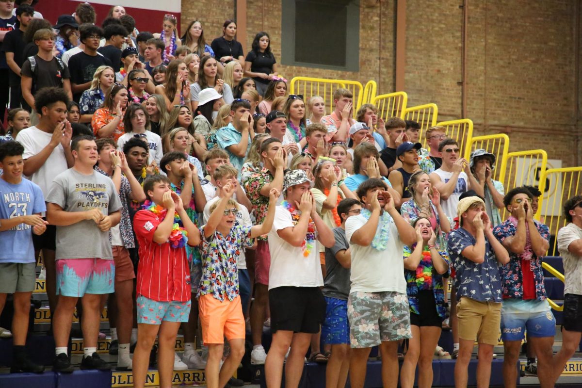 S.H.S.+students+do+a+chant+to+the+opposing+team.+Students+came+together+to+the+volleyball+game+against+Newman+High+School.+