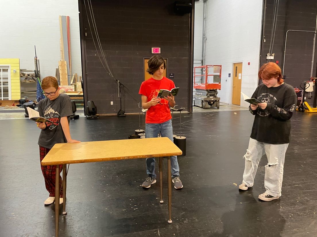 Senior Henry Oberg and juniors Rileigh Wren and Christina Moore rehearse one of their scenes. Cast member rehearse four days a week. 