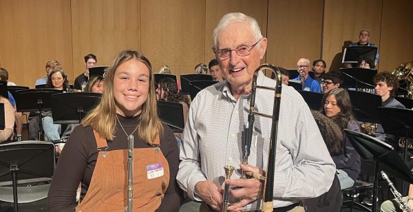 Freshman Juliet Funderberg poses with alumni Tom Slothower (Class of 1951). Slothower was the oldest alumni to perform at the concert. 