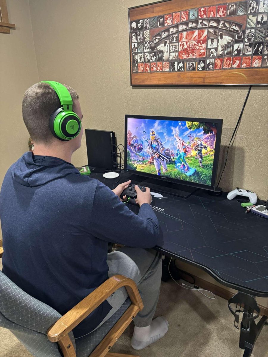 Senior Lucas Austin gets ready to play Fortnite. Austin enjoys playing the game with his friends.