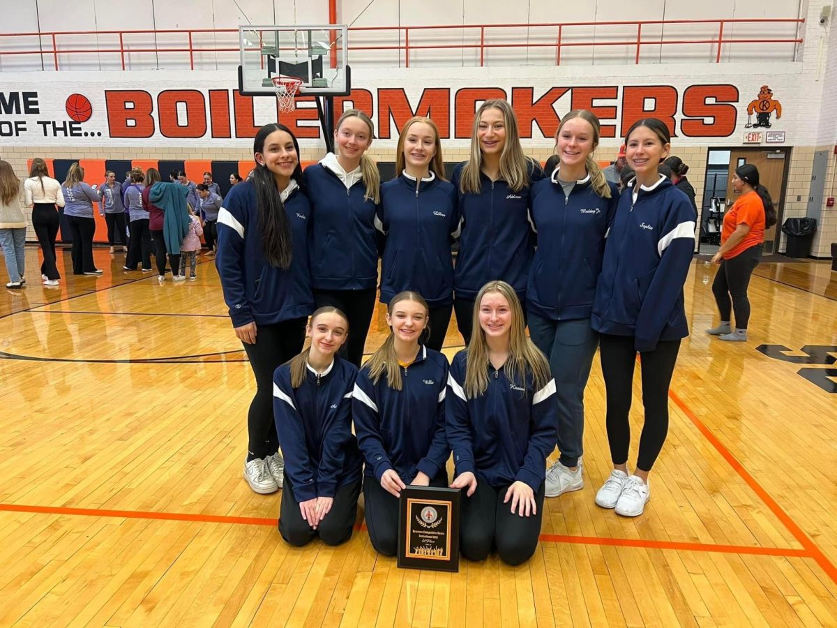 The poms competition team poses with their first place plaque from the Kewanee invitational. The team reclaimed first place after falling short to Feildcrest during the 22-23 season.  