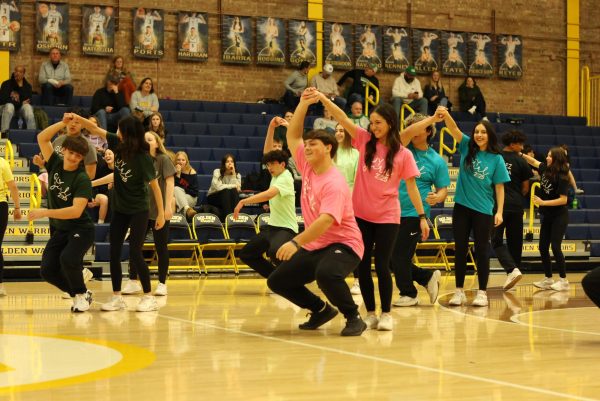 Junior Ellie Kested drops senior Lincoln Davis during guy girl dance. The guy girl dance was performed during the Geneseo game. 